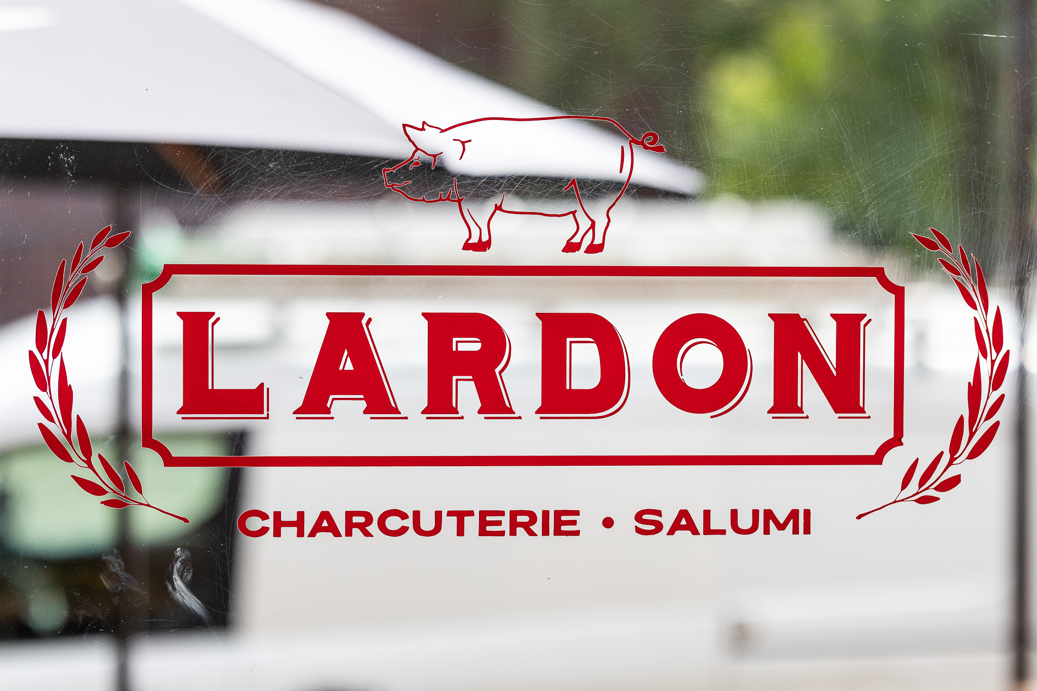 lardon Lardon logo on window
